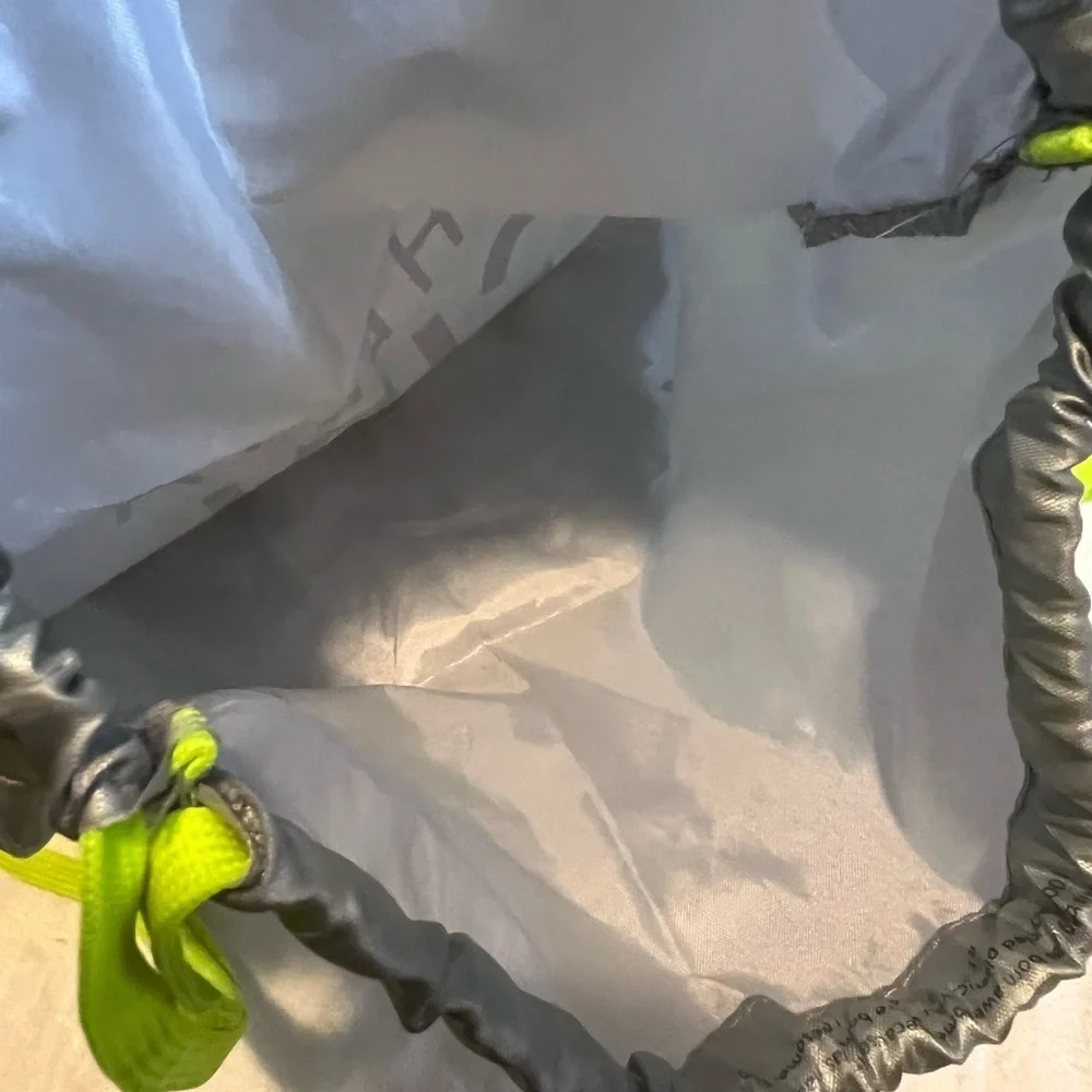 Athletta girl silver and neon green  cinch sack. Used, but life left in it.